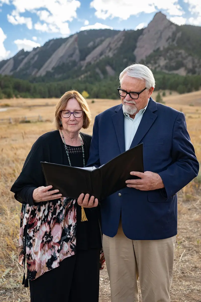 Benjamin and Teri Martin holding a ceremony book